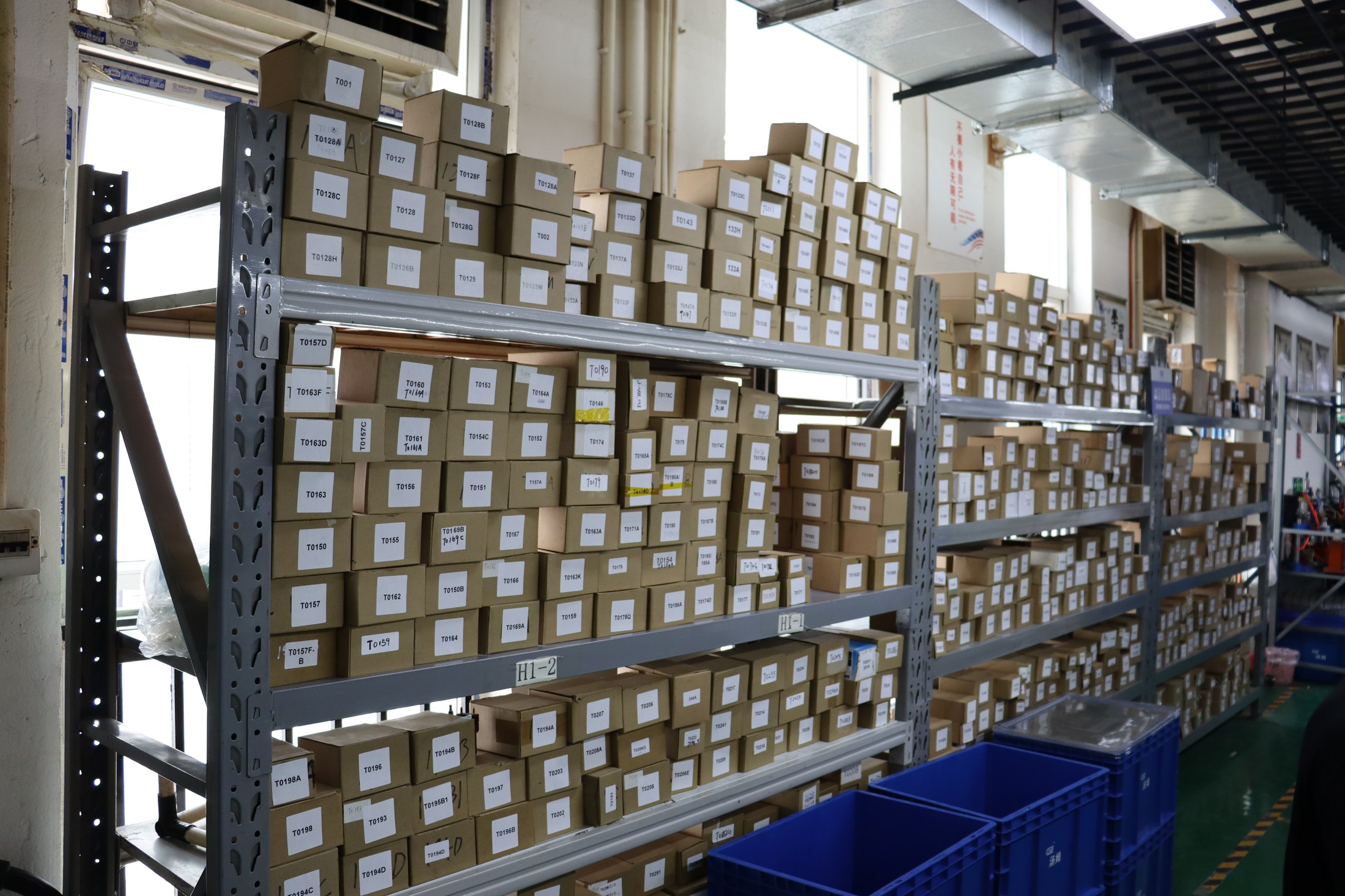ITOM warehouse shelves with labeled product stock